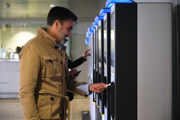 buying-train-ticket-at-self-service-kiosk-in-railway-station